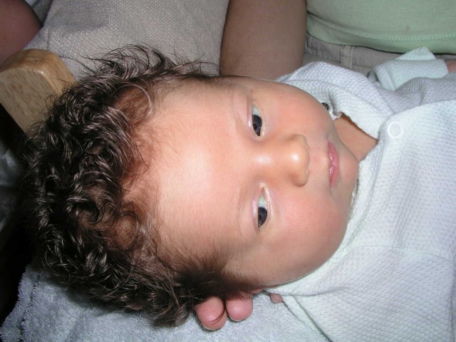 Curly-headed kid -- at least after a bath